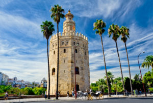 Spain, Seville, Torre del Oro, the Golden tower and a horse-drawn carriage Spain, Seville, Torre del Oro, the Golden tower and a horse-drawn carriage